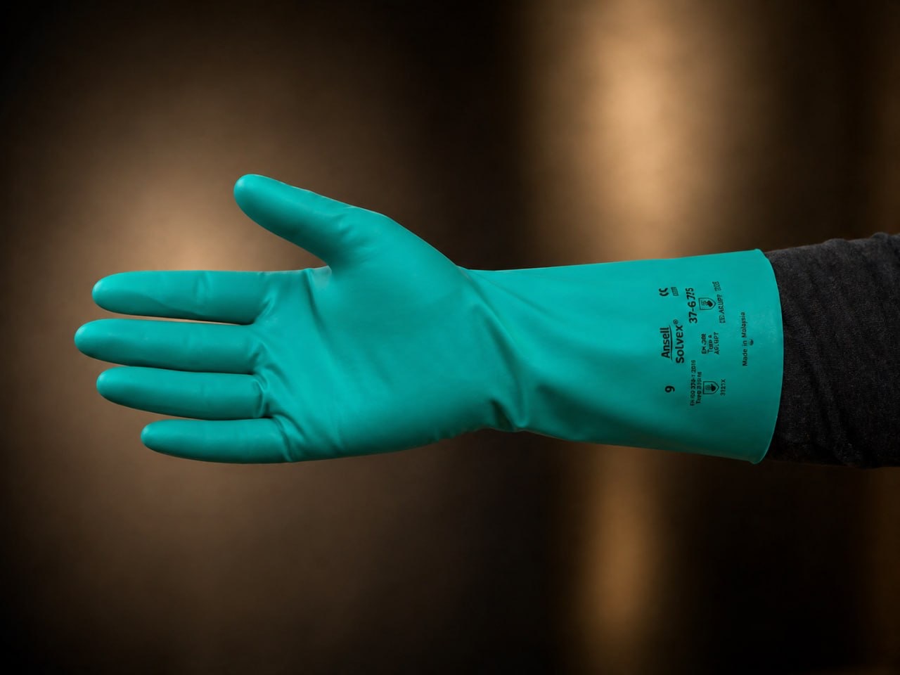 Green Ansell Solvex chemical-resistant nitrile glove for mixing and loading.